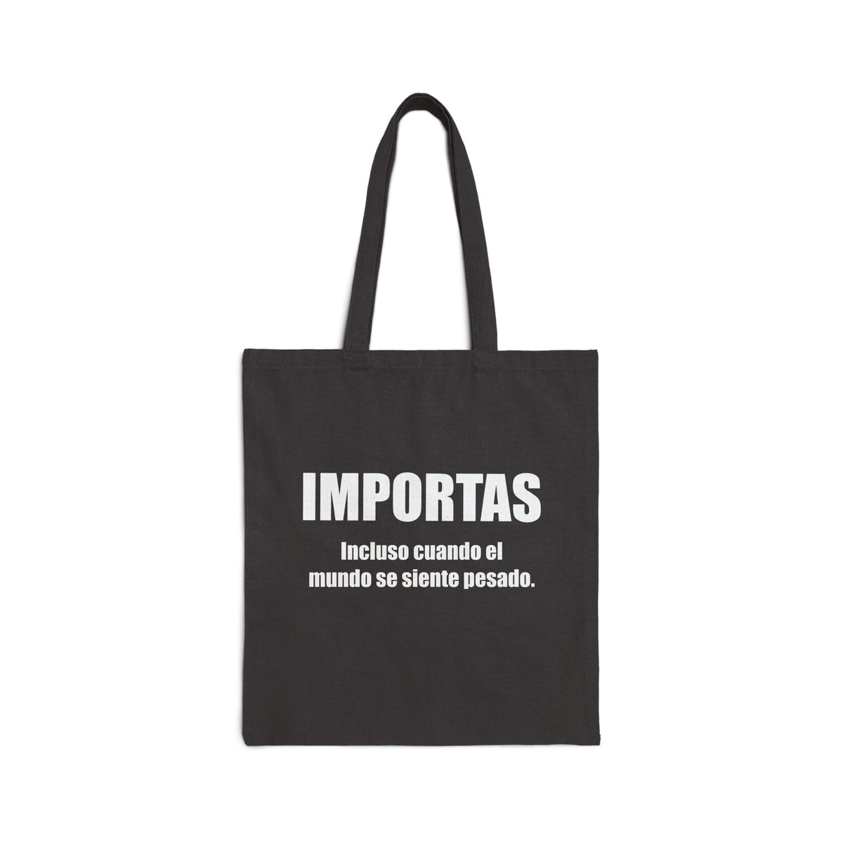 IMPORTAS Incluso cuando el mundo se siente pesado Tote Bag | Canvas Tote, Spanish Quote